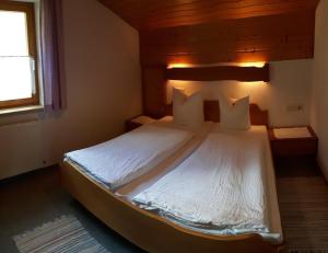 מיטה או מיטות בחדר ב-Apartmenthaus Immler