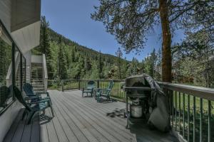 a deck with chairs and a grill on a house at Keystone Bristlecone Home 31 by SummitCove Lodging in Colorado in Keystone