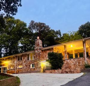 a large stone house with a stone wall at Bankston A in Marietta