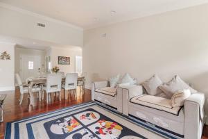 a living room with a couch and a dining room at Amazing days Spa Pool Villa near Disney & Beaches in Placentia