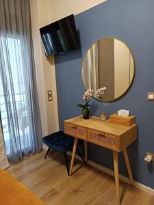 a dressing table and a mirror in a room at Filoxenia Luxury Apartment in Nafplio