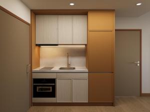 a kitchen with a sink and a stove at The Sebel Parramatta in Sydney