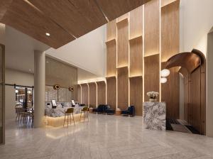 a lobby of a hotel with chairs and tables at The Sebel Parramatta in Sydney