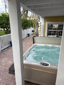 a hot tub on the patio of a house at LasPalmas Beach Rentals,3 in Bradenton Beach