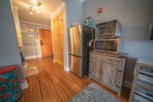 a kitchen with a refrigerator and a microwave at Gateway Lodge 5084 by SummitCove Lodging in Colorado in Keystone