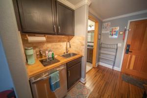 a small kitchen with a sink and a counter at Gateway Lodge 5084 by SummitCove Lodging in Colorado in Keystone +29 photos