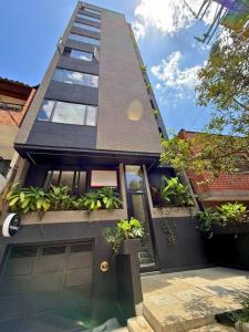 a house with plants on the front of it at Once Suites in Envigado