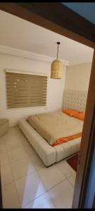 a bedroom with a bed in a room at Villa n 5 in Sidi Daoud