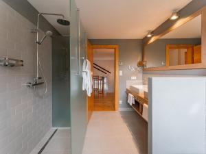 a bathroom with a shower and a glass door at Haus Aifnerspitze in Kauns +31 photos