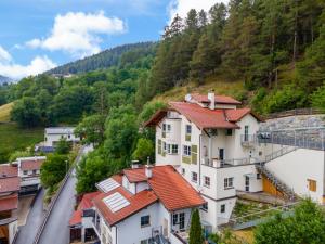 a view of a building with red roof at Haus Aifnerspitze in Kauns