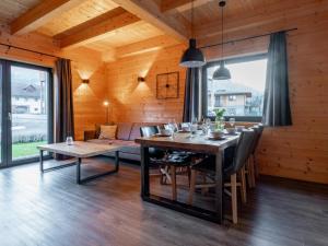 a dining room with a table and chairs at Rattendorf 11B in Rattendorf +30 photos