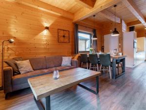 a living room with a couch and a table at Rattendorf 11B in Rattendorf
