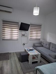 a living room with a couch and a table at Eid in Mostar