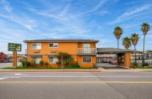 an orange building on the corner of a street at Sand Castle Inn in Seaside