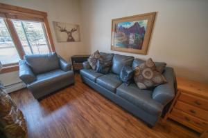 a living room with a couch and two chairs at Expedition Station 8554 by SummitCove Lodging in Colorado in Keystone