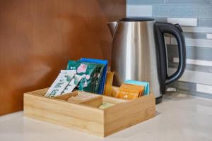 a wooden box filled with medicines and a tea pot at Kasa LoHi Denver in Denver +24 photos
