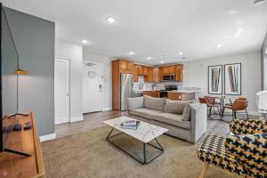 a living room with a couch and a table at Kasa LoHi Denver in Denver