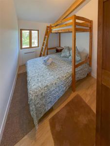 a bedroom with a bed with a ladder in it at Maison de campagne T3 Nature in La Martre +28 photos
