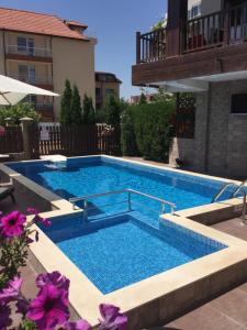 a swimming pool in the middle of a building at The White Houses Complex in Nesebar