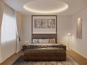 ein Schlafzimmer mit einem großen Bett und einer weißen Decke in der Unterkunft Halora Ten Lua Hotel in Ho-Chi-Minh-Stadt + 18 Fotos