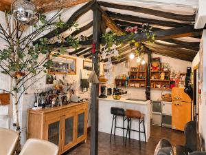 a kitchen with a counter and a bar in a room at 스테이여온 in Miryang