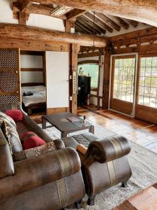 a living room with a couch and a table at 스테이여온 in Miryang