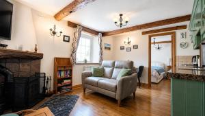 a living room with a couch and a bed at 1 Bed in Winskill oc-c36298 in Little Salkeld