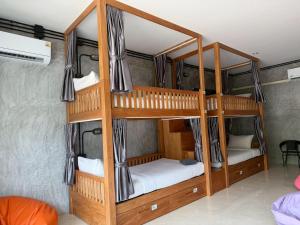 a bunk bed room with two bunk beds in it at Friendlyhostel in Khao Sok National Park