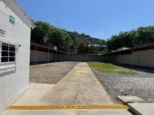 an empty parking lot next to a building at Marqués 100 Exmarquesado in Oaxaca City