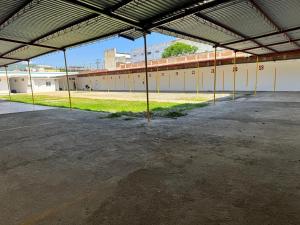 an empty parking lot in a large building at Marqués 100 Exmarquesado in Oaxaca City +5 photos