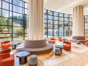 a large room with chairs and tables and windows at KAMENOI HOTEL Fuji in Fujiyoshida +101 photos