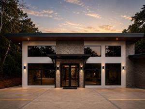 an office building with glass windows and doors at Calathea Hotel Monteverde in Monteverde Costa Rica