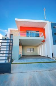 a large house with a staircase in front of it at Luxury Comfort Villa in Punta Cana