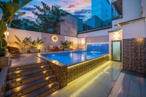 a swimming pool in the middle of a house at KLY Hotel & Retreat in Vung Tau