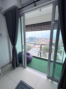 a room with a large window with a view at Ezae Studio D'Perdana Apartment in Kota Bharu