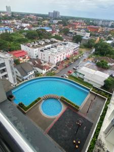 an overhead view of a swimming pool in a city at Ezae Studio D'Perdana Apartment in Kota Bharu
