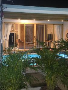 a house with a pool in front of a living room at Golden Villa in Ko Phangan +33 photos