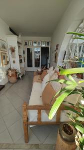 a room with a bunch of pillows on a couch at Casa Ecléctica in Santiago del Estero