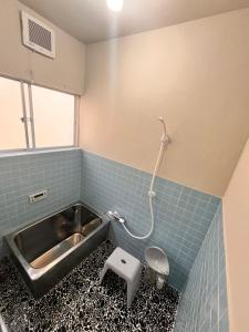 a bathroom with a sink and a toilet at 城下の宿庵 in Ōzu