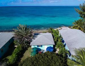 an aerial view of a house and the ocean at Sand Star in Russel Island