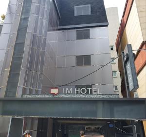 a hotel with a sign on the front of it at IM Hotel in Seoul