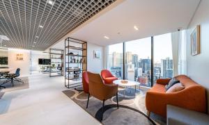 an office with a view of the city at Archieve 4H hotel Busan in Busan