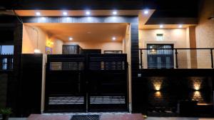 a view of the inside of a building at night at Quiet Corner 4BHK Villa in Lucknow
