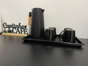 a coffee maker on a tray on a table at Casa Premium NOVA - Perto do Shopping em SINOP in Sinop