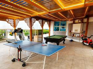 a ping pong table in a room with a ping pong ball at Hurghada Porto View in Hurghada