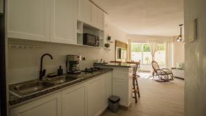 a kitchen with a sink and a counter top at Nice View always available in Juan Dolio