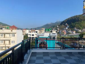 a balcony with a view of a city at Monastery View Homestay in Kathmandu