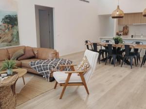 a living room with a couch and a table at Adagio at Lonsdale in Point Lonsdale
