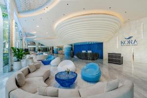 a lobby of a hotel with couches and tables at Beachfront Luxury Apartment Bangtao Phuket in Bang Tao Beach +285 photos