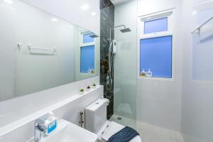 a white bathroom with a toilet and a shower at The Garnet Light Pool Villa Aonang-3BR Private Pool Villa in Ao Nang Beach +21 photos